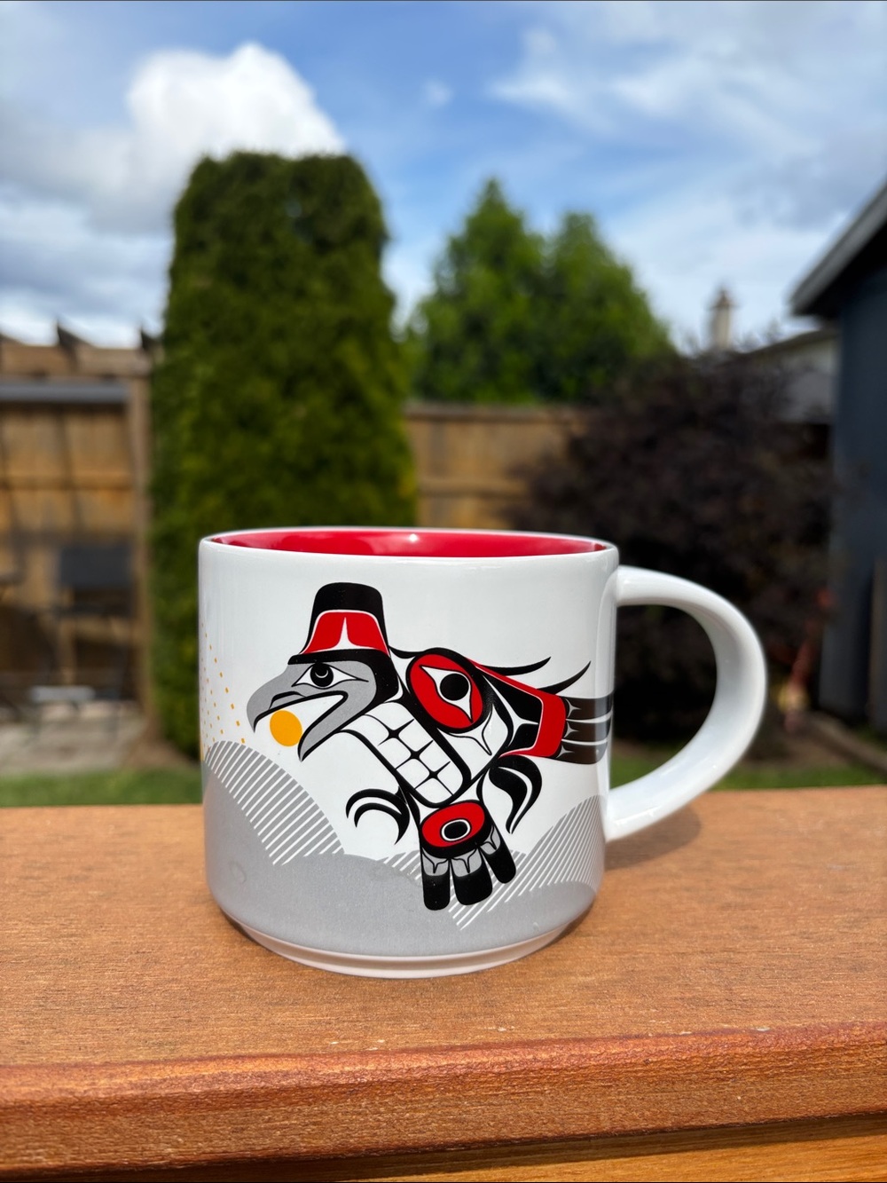 White and Red Ceramic Mug with Indigenous-Style Raven Artwork